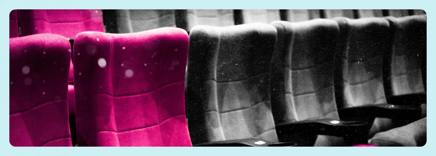 Theater seats colored pink and black, designed by Paradigm