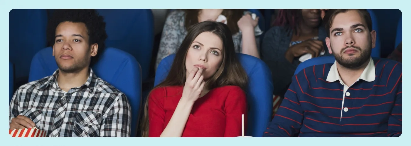 People watching a movie in a theater