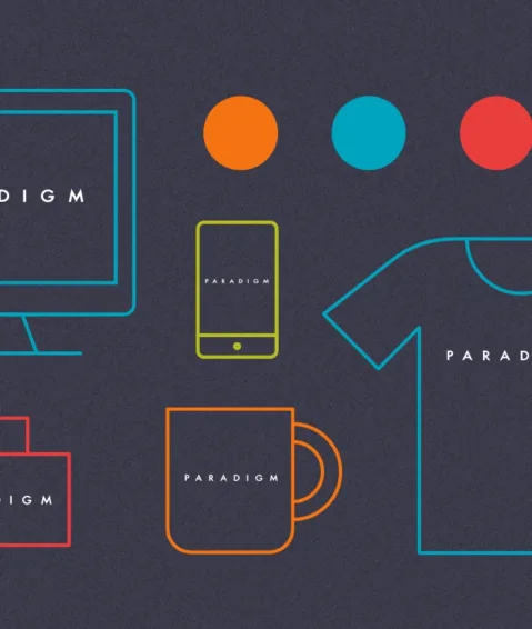 A visual representation of Paradigm's brand identity on screens, clothing, and promotional materials.