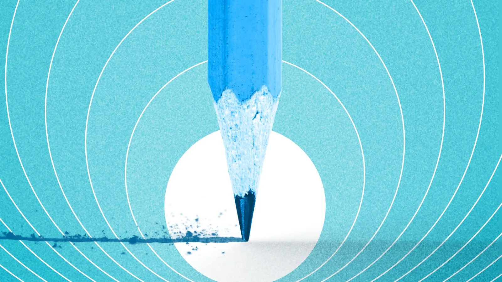 a pencil drawing a line across a page on a blue background