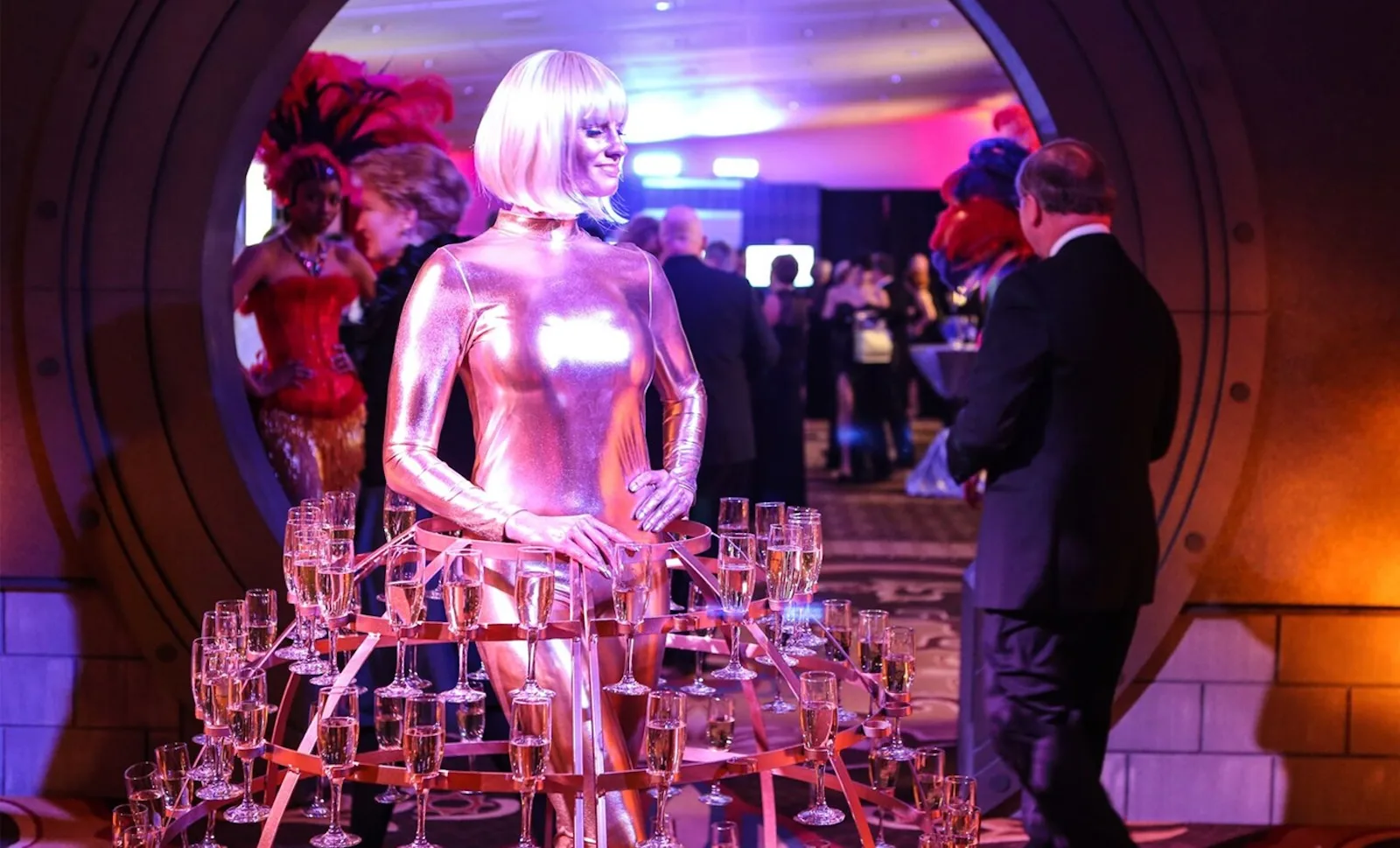 Contemporary Productions event with woman in a dress made out of champagne glasses